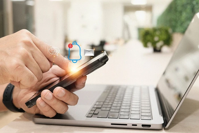 03 man holding cell phone gets a popup alert